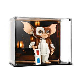 Angled view of LEGO Gremlins Gizmo 21361 in acrylic display case with printed Chinese shop background