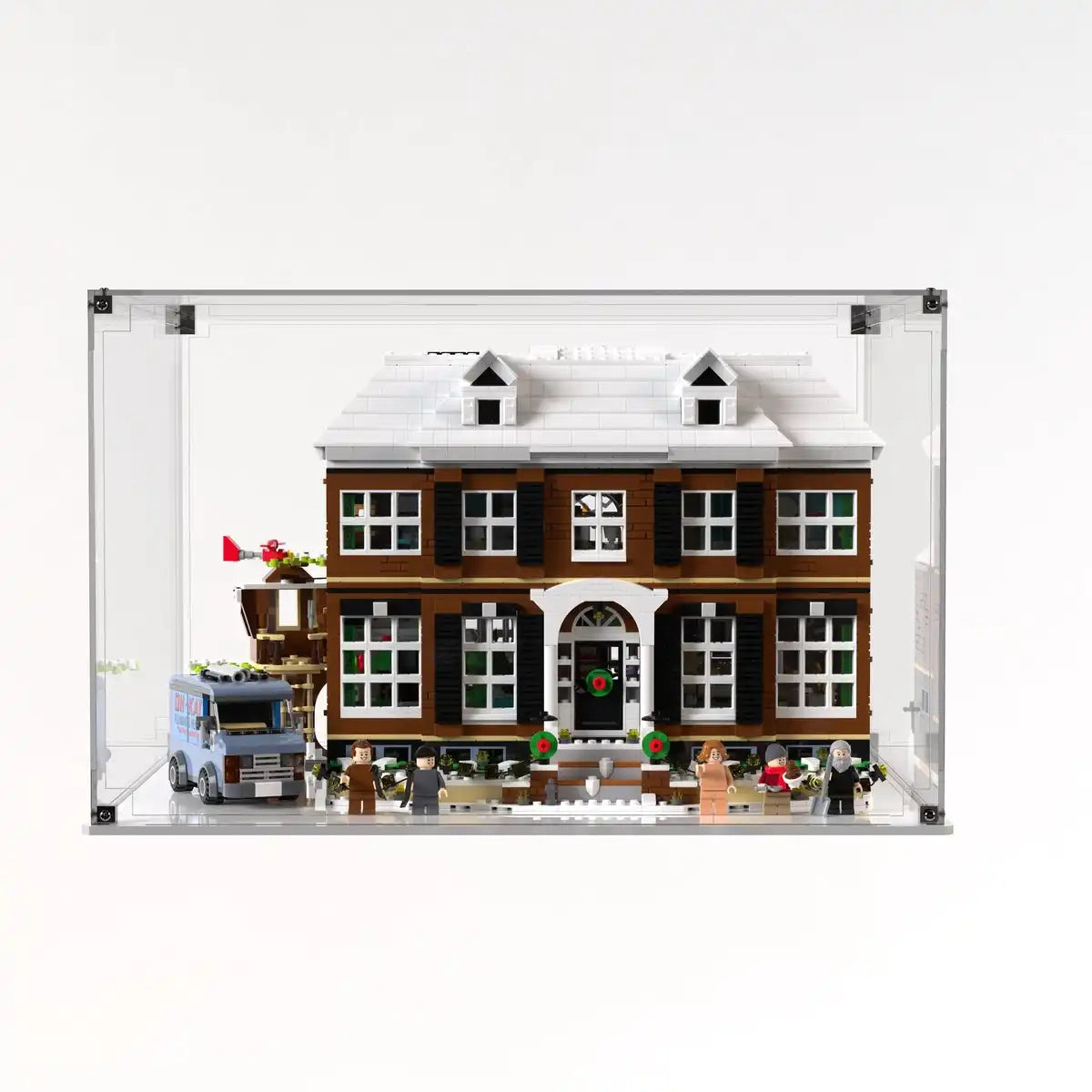Front view of the LEGO Home Alone house inside the clear dustproof case