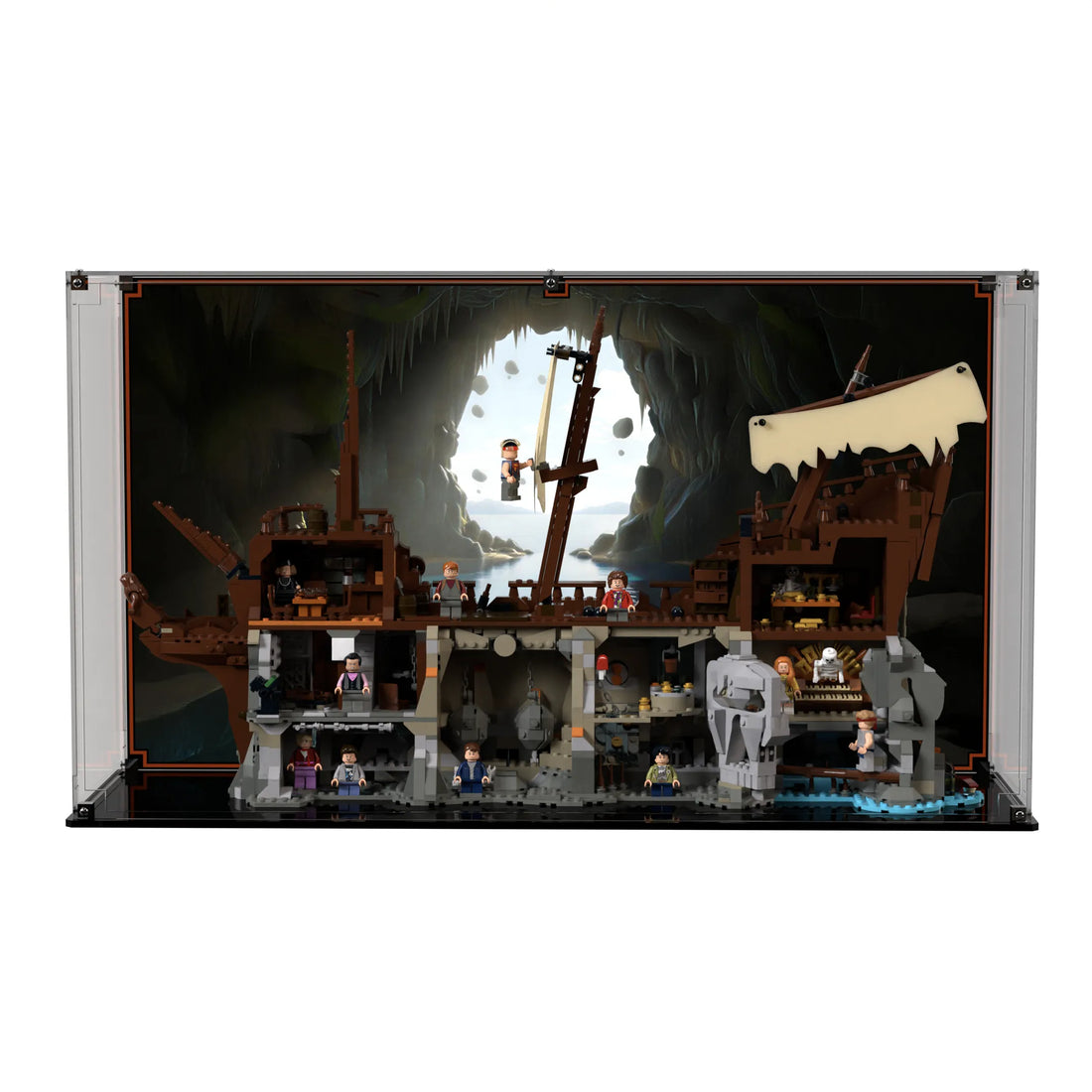 Brick In It premium acrylic display case for LEGO Ideas The Goonies (21363) set, printed coastal-cavern background view facing front.